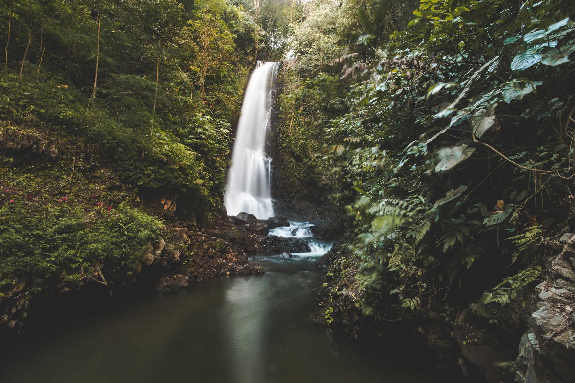 an incredible waterfall in costa rica