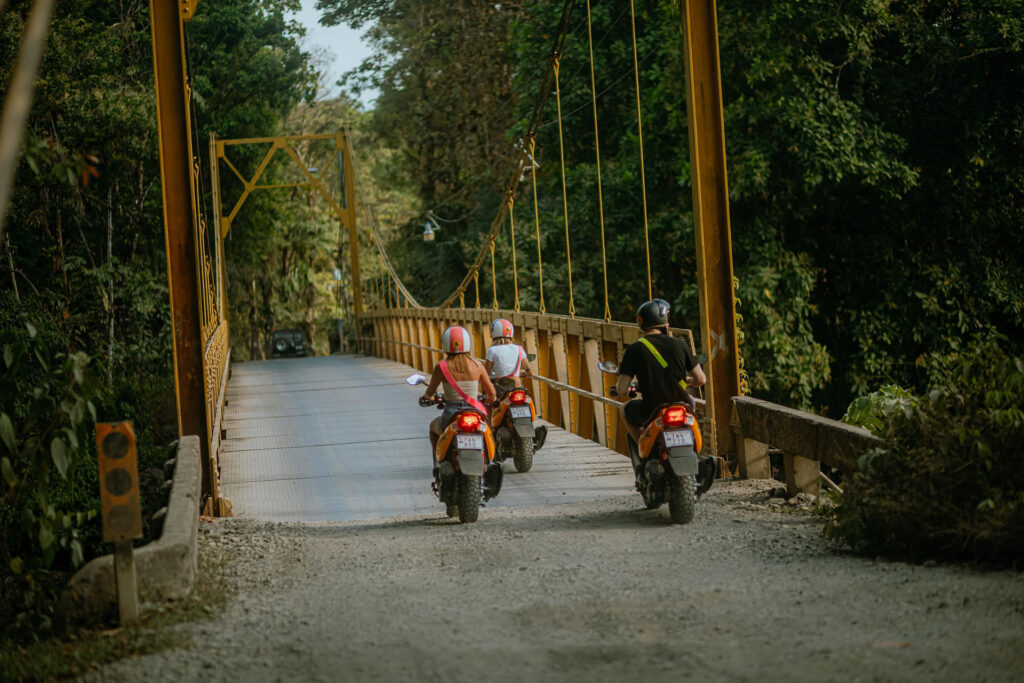 People with rented scooters riding in Costa Rica