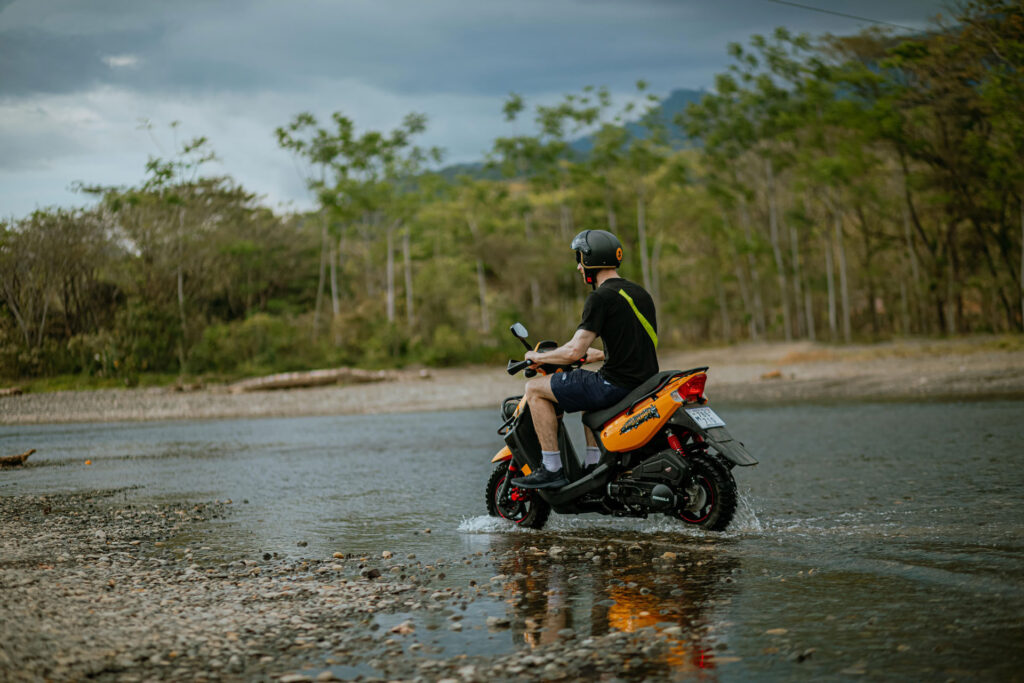 Man having fun on rented scooter